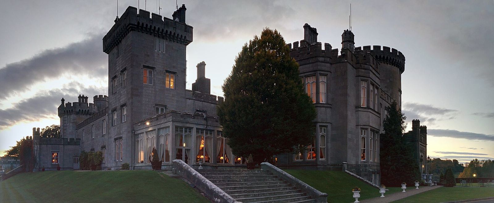 Dromoland Castle at dusk, its windows lit
